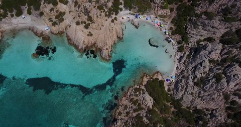 Aerial video of Cala Napoletana on the coastline of Caprera Island in Emerald Coast of Sardinia.