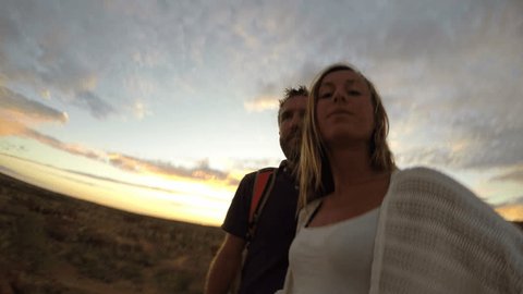 Two adults take selfie portrait with spectacular landscape at sunrise
Couple travelling in Australia taking selfies in the outback 