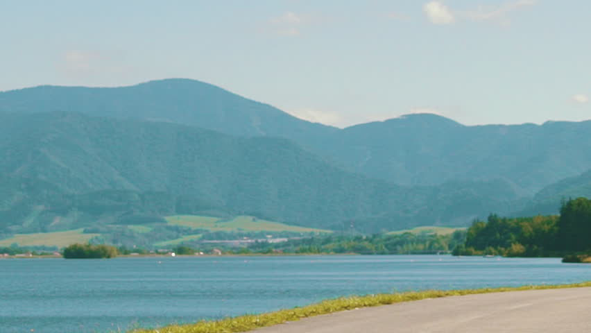 Young running woman run training close-up sneakers in mountains background