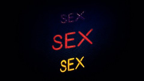 A flickering neon sign over a wall, with the text Sex. Embossed style.
