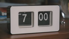 Flip clock mechanism. 7-00 AM. Close-up and wide shots editing. Super slow motion 240 fps - Powered by Shutterstock - Get 15% off with code: PIKWIZARD15