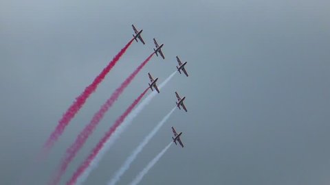 Aircrafts Performing Aerobatics in Formation During Air Show