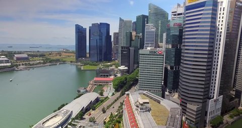 Tracking generic drone shot of financial center skyline - Singapore 2016