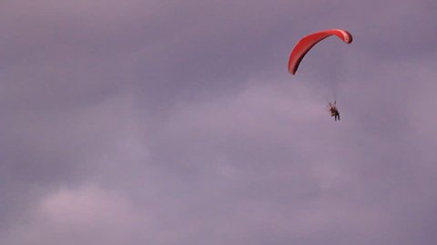 Paraglider pilot in flight