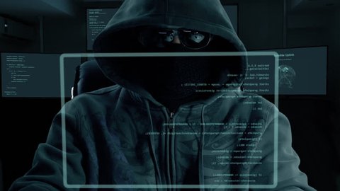 Male hacker typing program code. Dark night man at virtual screen coding. Programmer coding software of site. A hacker is preparing an attack on hacking portal.