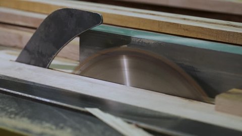 A close-up of a sawing circle that cuts the board.