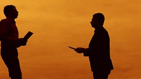 businessman discussion sunset silhouette sunlight standing clipboard concept. two businessman men swearing conflict outdoors fight looking at slow motion video
