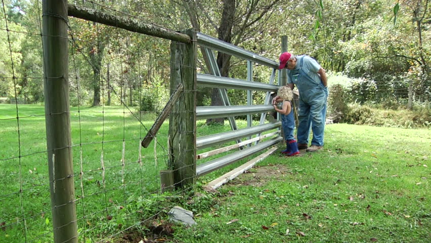 Grandchildren spending time with granddad on the farm. Old farmer taking time with grandchildren on hobby farm. Young and old having quality time together. 