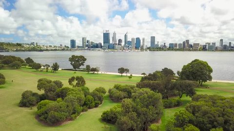 Aerial footage over Sir James Mitchell Park in South Perth with the Perth city skyline visible in the distance. Western Australia.