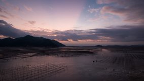 Sunrise time lapse over the mudflat in Xiapu country, Fujian province, China.