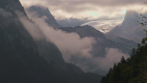 View of Dachstein from the lake Gosausee, Upper Austria - Foggy morning