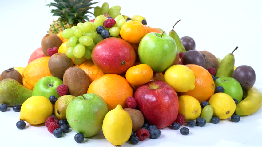 4k dolly move pile of many different fresh organic healthy fruits isolated on white background
