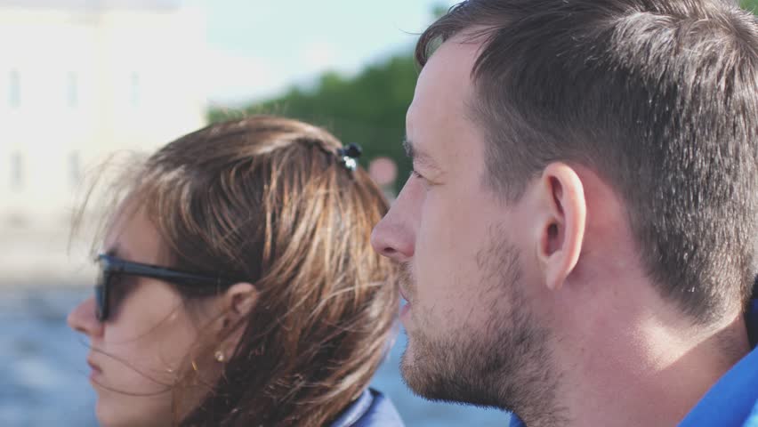 Couple tourists floating on a boat tour on the canals of St. Petersburg in slow motion. 3840x2160