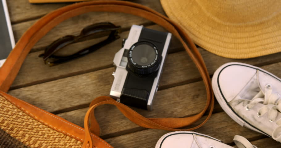 Overhead of travel accessorizes on table 4k