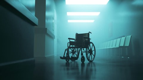 03004 Standard manual wheelchair in empty, foggy hospital corridor. Zoom in camera.