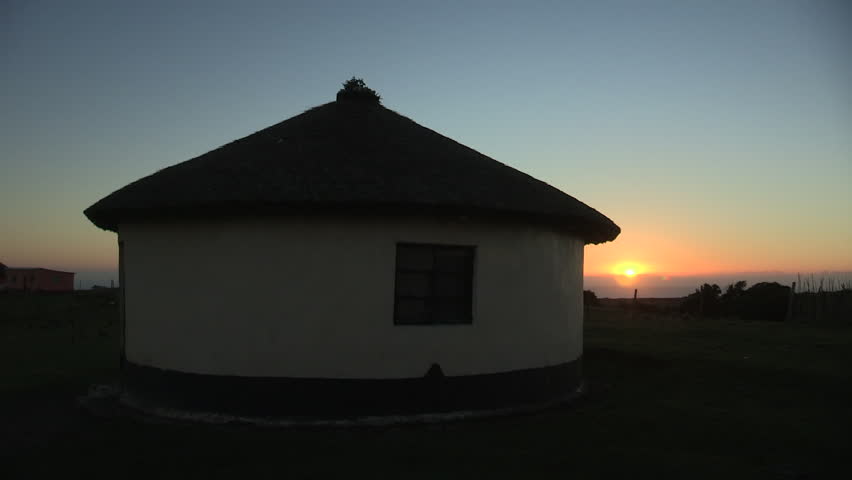 Sunrise next to Xhosa hut.