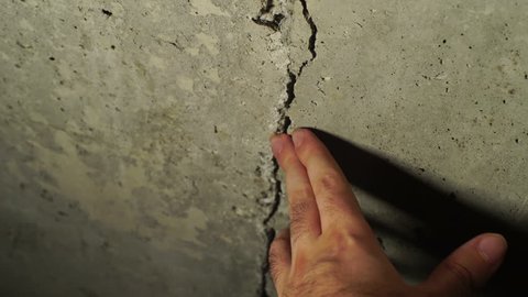 a crack in the foundation of concrete