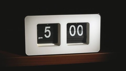 Flip clock mechanism. 5-00 PM. Close-up and wide shots editing. Super slow motion 240 fps.

