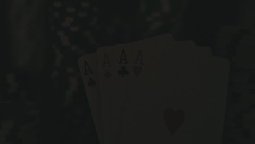 Four Aces On Poker Chips. Poker Table With Chips In Casino
