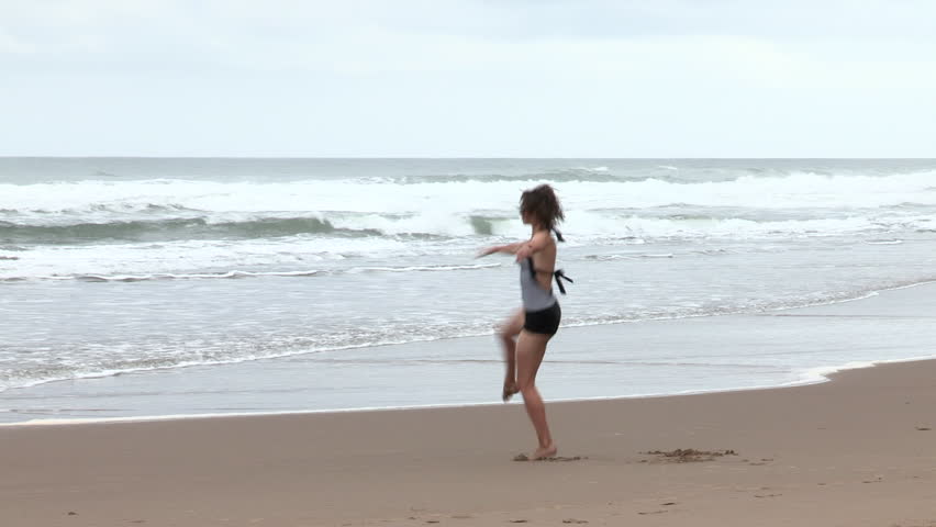 Girl Dancing on Beach