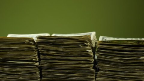 Money Grow & Shrink Timelapse
Three stacks of bills grows and shrinks in a loopable timelapse