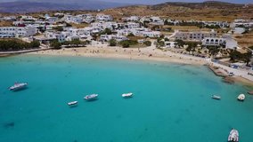 Aerial drone video from famous port of Koufonisi island with tropical turquoise and emerald clear waters, Cyclades, Greece