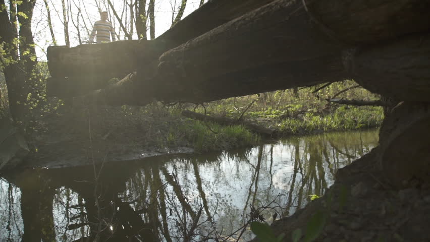 A man on a walk with a bicycle in the park