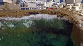 Spring 2017: Aerial bird's eye view video taken by drone of iconic and picturesque port of Naousa village, Paros island, Cyclades, Greece