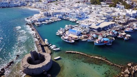 Spring 2017: Aerial bird's eye view video taken by drone of iconic and picturesque port of Naousa village, Paros island, Cyclades, Greece