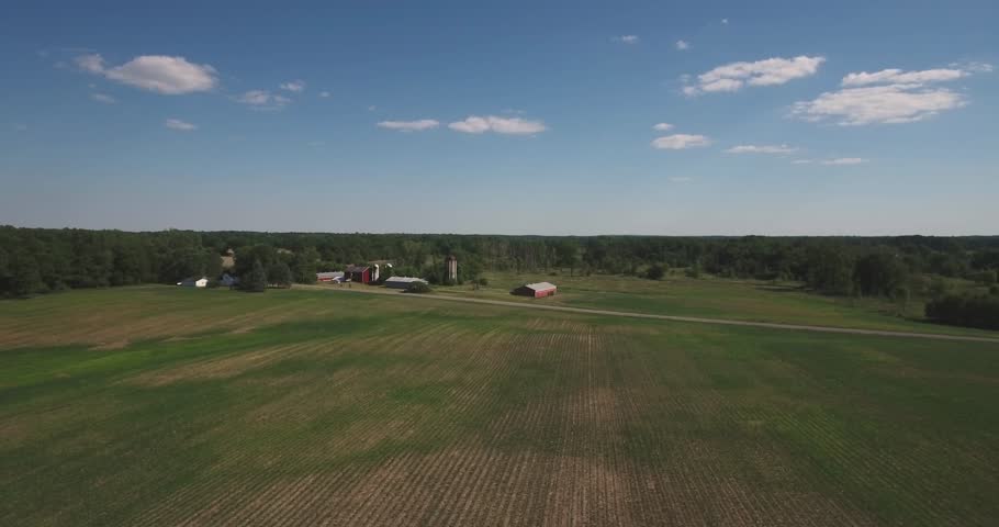 Flying over a midwest farm and blue skies 1