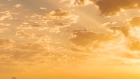 Close up of bright shining sun rising above clouds. Colorful cloudy sky in the sunset. Loop. Beautiful epic scenic cumulus clouds rolling over sky background backlit by sunset. Dark red purple sunset. - Powered by Shutterstock - Get 15% off with code: PIKWIZARD15