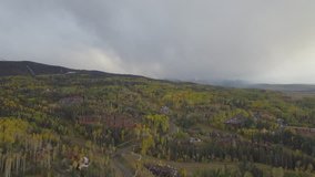 4K Gorgeous Rocky Mountains fall drone/aerial birdseye footage. Telluride Mountain Village, historic town, aspen and pines above the ski slopes and ski lift runs, San Sophia Overlook Ski Village area