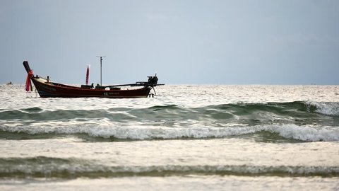PHUKET , THAILAND,NOV 2017 : Fishermen sailing boat to the sea to go fishing in the Andaman Sea.In the Andaman Sea with the natural integrity of marine animals