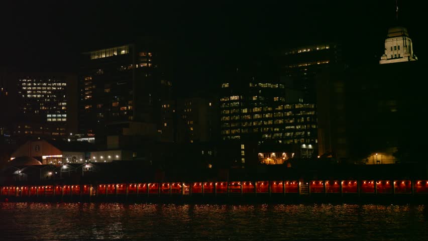 A beautiful establishing shot of Halifax Nova Scotia Canada city at night from the ocean