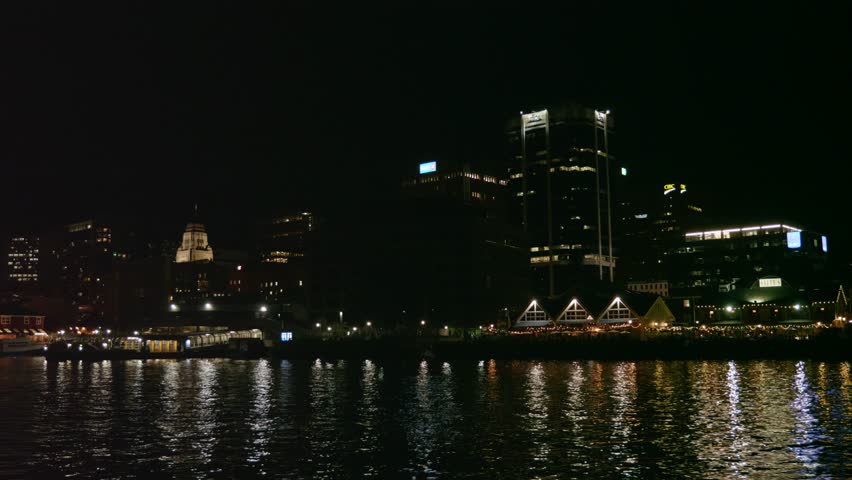A beautiful establishing shot of Halifax Nova Scotia Canada city at night from the ocean