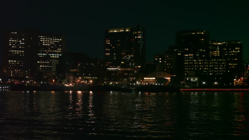 A beautiful establishing shot of Halifax Nova Scotia Canada city at night from the ocean