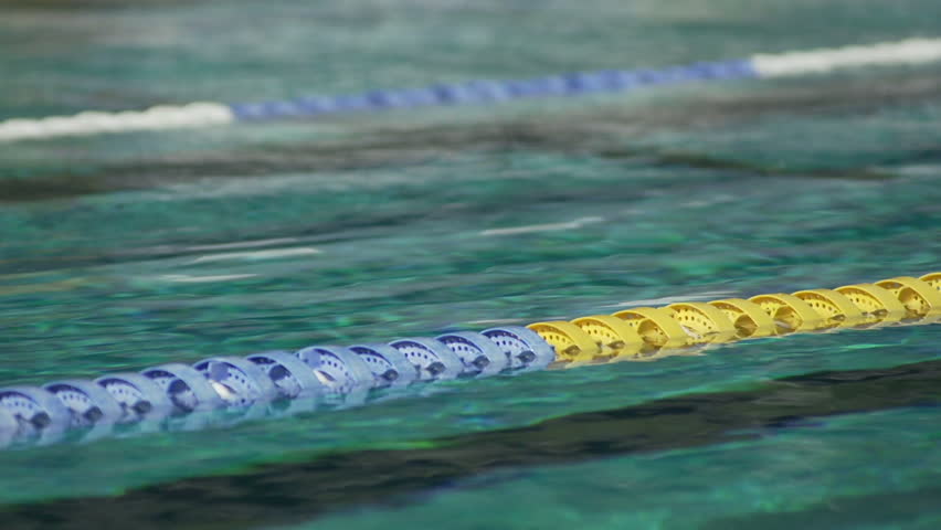 Close Shot Of Swimming Pool Water With Swimming Lane Markers