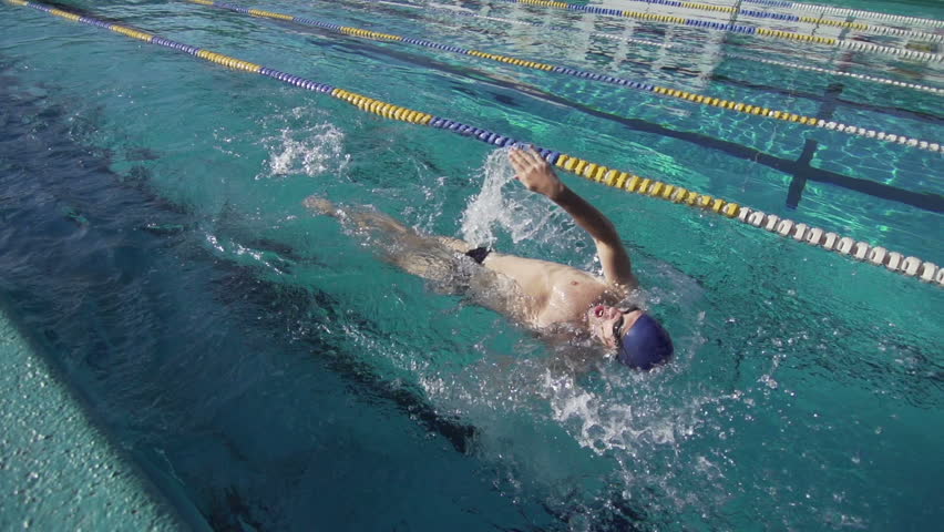 Slow Motion Of Professional Swimmer Swimming The Backstroke