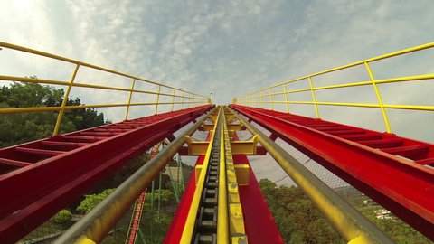 roller coaster rides up incline on track