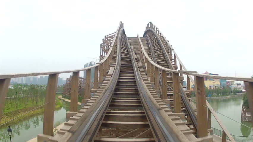 Flying through turns on wooden roller coaster