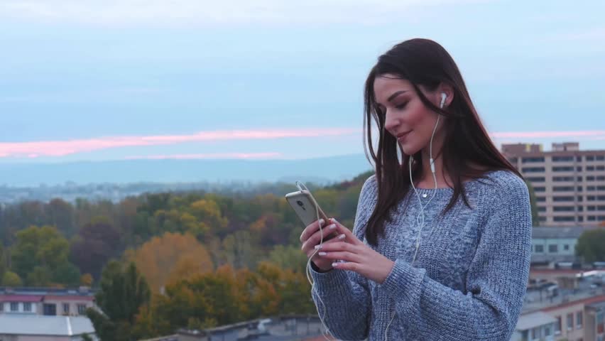 A young girl listening music