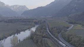 Aerial drone footage view of Train near a river in italy //no video editing