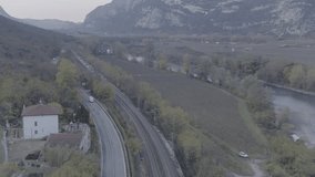 Aerial drone footage view of Train near a river in italy // no video editing
