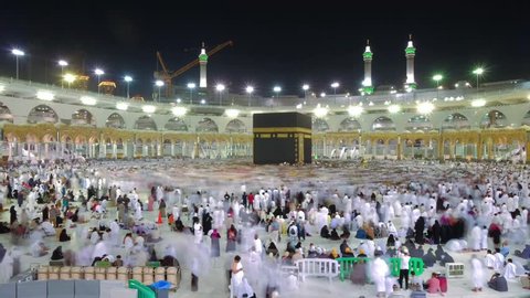 Mecca, Saudi Arabia - CIRCA September, 2017: Time lapse video of Muslim pilgrims circling around the holy Kaaba at night during Hajj inside al Masjid al Haram in Mecca, Saudi Arabia. Camera static.