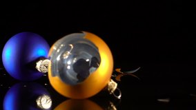 three falling and broken christmas balls on black background, slow motion 250 fps - Powered by Shutterstock - Get 15% off with code: PIKWIZARD15