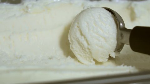 Vanilla ice cream being scooped. Close-up view.