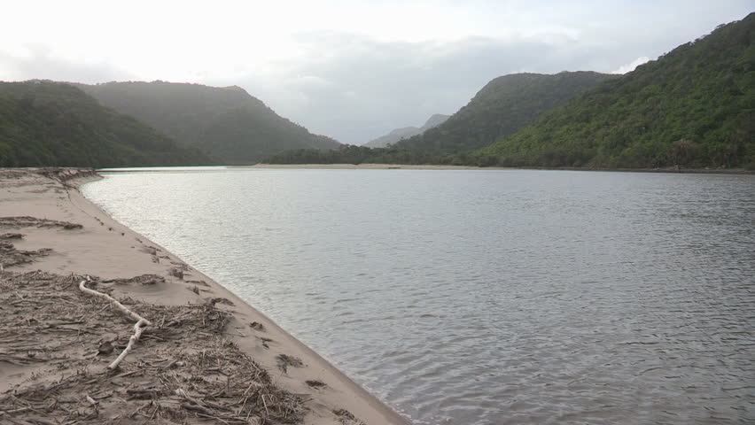 Pan from the  Ntafufu river lagoon to the beach at Manteku camp along the