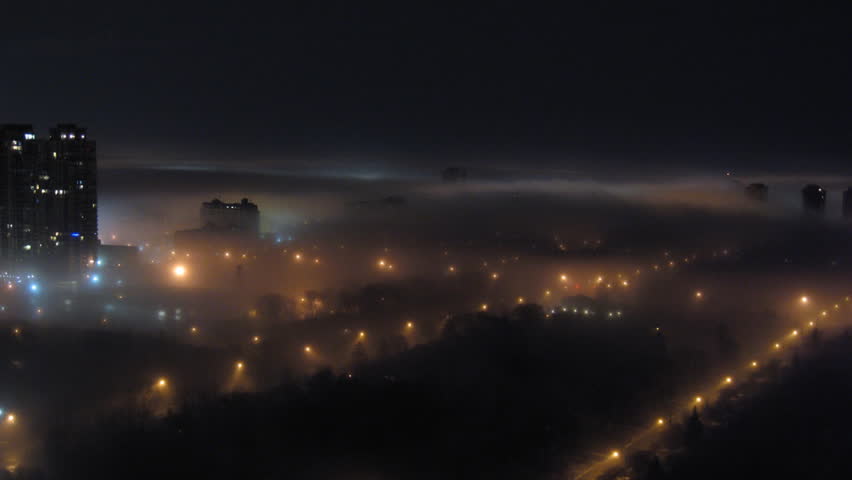 Foggy City Night Time-Lapse 1. Timelapse shot of a city late at night blanketed
