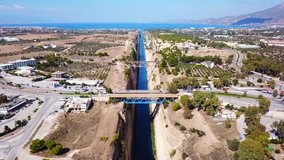 Aerial bird's eye view video taken by drone of famous Corinth Canal of Isthmos or Isthmus, Peloponnese, Greece