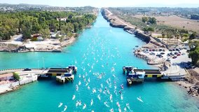 Aerial bird's eye view video taken by drone of paddle surfing in Corinth Canal of Isthmos or Isthmus, Peloponnese, Greece